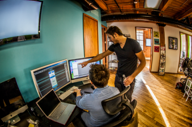 Joe Joachim working hands-on with his interactive design team.